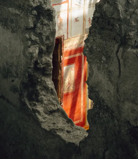 A painted figure on a weathered stone wall